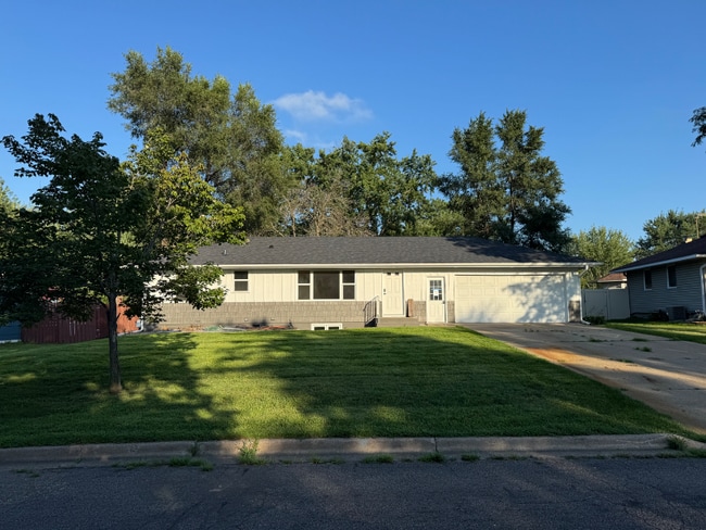 property at 10919 Woody Ln NW