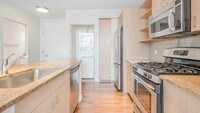 Kitchen with Granite Countertops and Stainless Steel Appliances - 660 Washington Apartments in Boston, Massachusetts