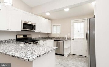 2409 E Cold Spring Ln in Baltimore, MD - Building Photo - Building Photo