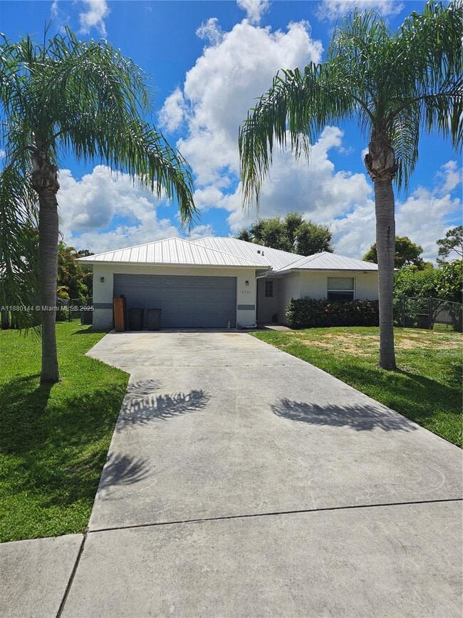 property at 8330 SE Sweet Bay Ave