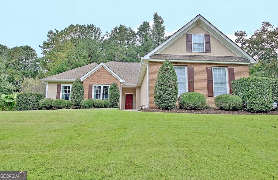 21 Wellington Mnr Dr, Unit 202 in Sharpsburg, GA - Foto de edificio