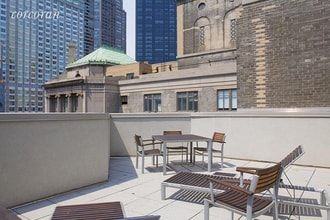 100 W 58th St in New York, NY - Building Photo - Building Photo