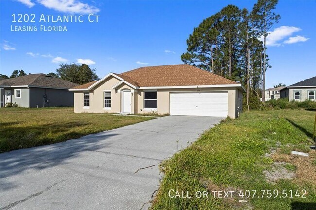 1202 Atlantic Ct in Poinciana, FL - Foto de edificio - Building Photo