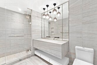 135 W 52nd St-Unit -: 15F in New York, NY - Building Photo - Building Photo