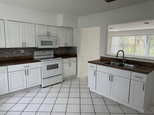 property at 6884 NW 14th St