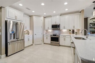 9653 Montelanico Loop-Unit -102 in Naples, FL - Building Photo - Building Photo