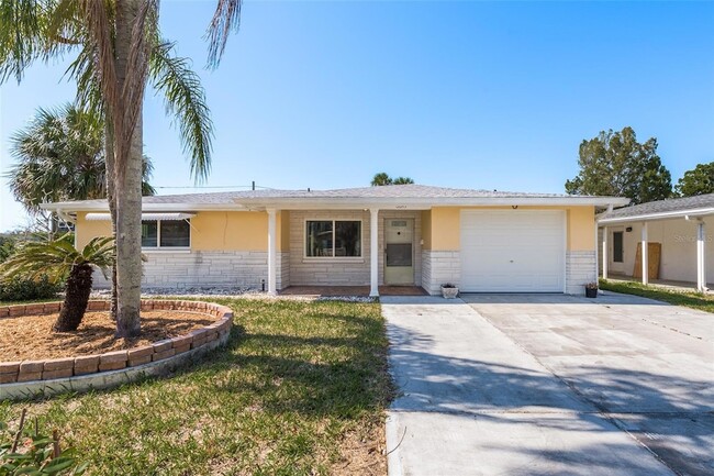 6647 Manor Beach Rd, Unit 1040FlatsAveApt407 in New Port Richey, FL - Building Photo - Building Photo