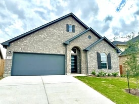 703 Durian Loop in Mustang Ridge, TX - Building Photo