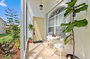 6077 Lake Hibiscus Dr in Delray Beach, FL - Building Photo