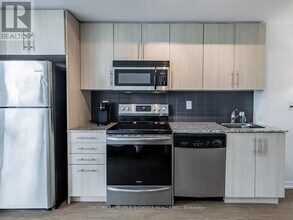 65-1265 Bremner Blvd in Toronto, ON - Building Photo - Building Photo