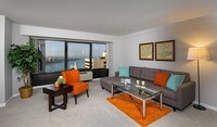 Spacious living rooms with a view! - Riverfront Towers Apartments in Detroit, Michigan