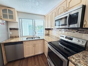 9201 Lime Bay Blvd in Tamarac, FL - Building Photo - Building Photo