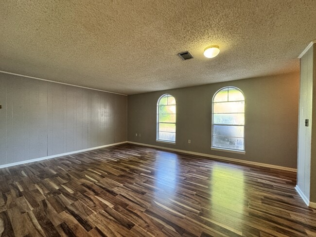 property at 203 E John Sims Pkwy