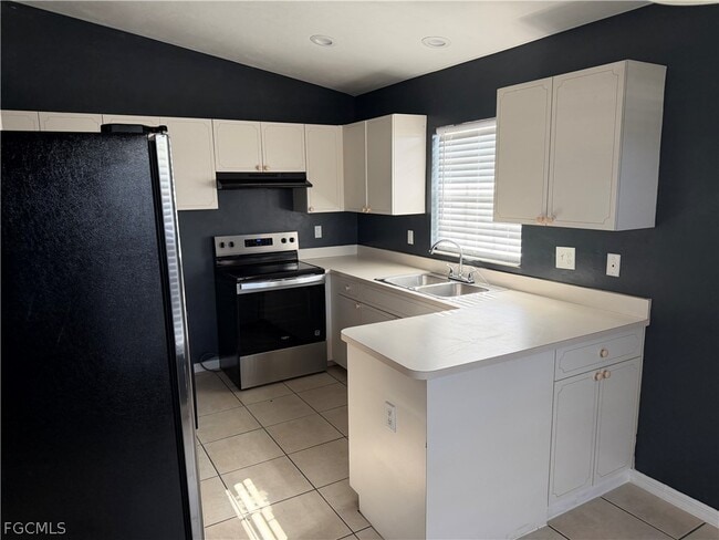 property at 4928 Leonard Blvd S
