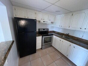 400 Village Green 216 Cir in Palm Springs, FL - Building Photo - Building Photo