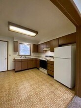 208 S Spring St, Unit APT. A in Wakarusa, IN - Building Photo - Building Photo