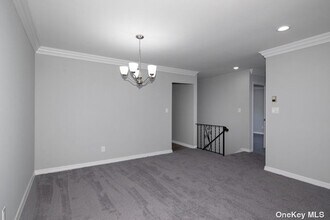 120 Sussex Pl, Unit PA23 in Bohemia, NY - Building Photo - Building Photo