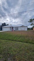 6480 NW Volucia Dr in Port St. Lucie, FL - Building Photo