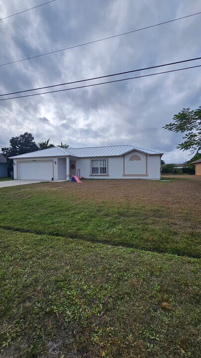 6480 NW Volucia Dr in Port St. Lucie, FL - Building Photo
