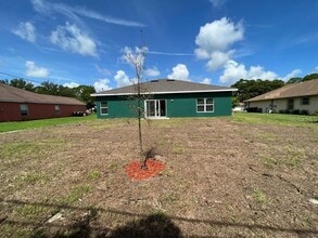 407 Treemont Ave in Palm Bay, FL - Foto de edificio - Building Photo