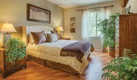 Bedrooms feature wood flooring throughout and spacious closets - Palazzo East Apartments in Los Angeles, California