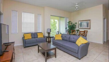 5259 Cane Island Loop, Unit 404 in Kissimmee, FL - Building Photo - Building Photo