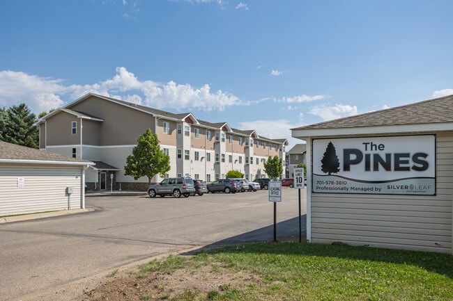The Pines Luxury Security Apartments in Minot, ND - Building Photo - Building Photo