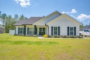 9861 Shangri La West Rd in Milton, FL - Building Photo