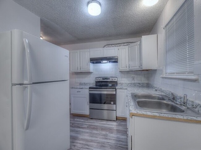 property at 1129 S 124th E Ave