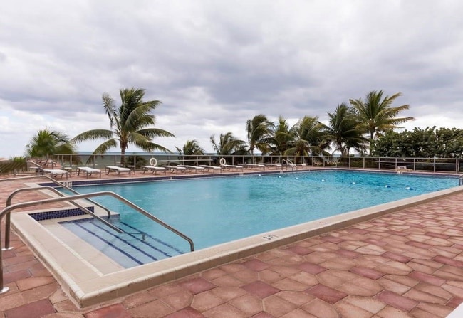 property at 6039 Collins Ave