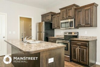 209 NE Kim Ct, Unit 54 in Grain Valley, MO - Foto de edificio - Building Photo