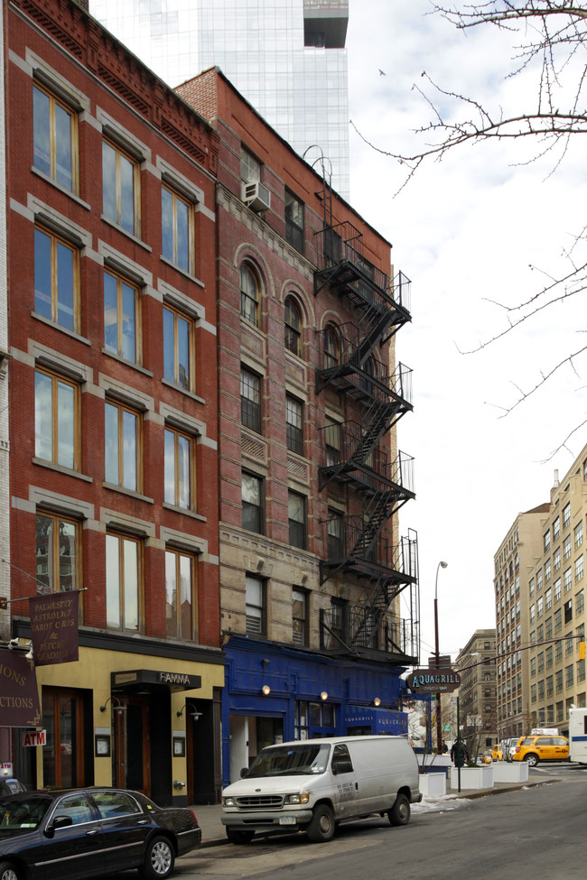 208-210 Spring St in New York, NY - Building Photo - Building Photo