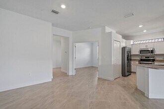 14107 Winding Cedar Wy in Miromar Lakes, FL - Building Photo - Building Photo