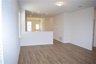 951 Pepperbark Loop in Mustang Ridge, TX - Building Photo - Building Photo