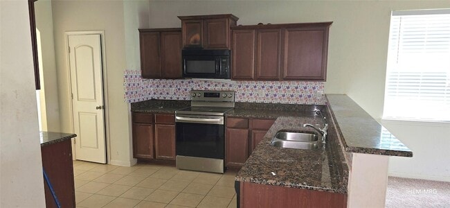 4903 Jagged Cliff Ln in Rosenberg, TX - Foto de edificio - Building Photo