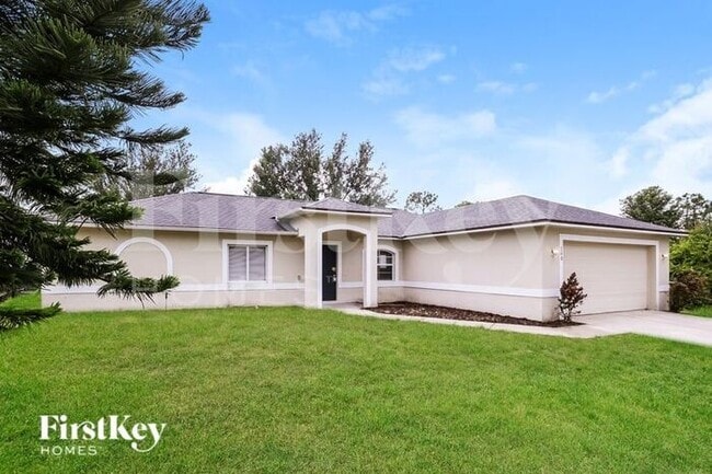 708 Theodore Vail St E in Lehigh Acres, FL - Building Photo - Building Photo
