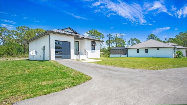 2343 Oil Well Rd in Naples, FL - Foto de edificio - Building Photo