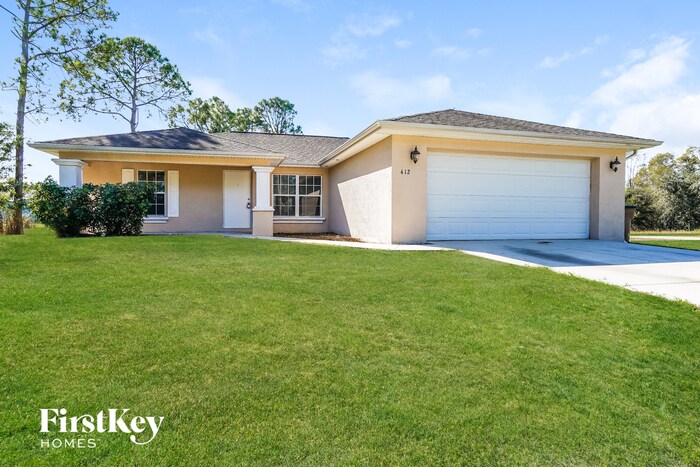 412 Harshaw St in Lehigh Acres, FL - Building Photo