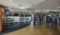 Fully-equipped fitness center includes cardio and weight training machines - Broadcast Center Apartments in Los Angeles, California