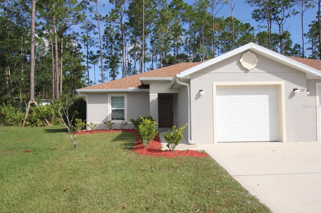 32 Regency Dr in Palm Coast, FL - Foto de edificio