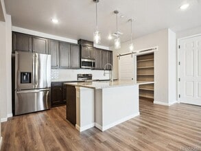 6153 N Ceylon St, Unit 10-303 in Denver, CO - Building Photo - Building Photo