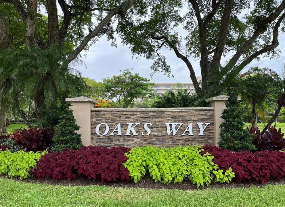 3520 Oaks Way, Unit 407 in Pompano Beach, FL - Building Photo