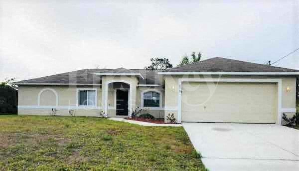 708 Theodore Vail St E in Lehigh Acres, FL - Building Photo
