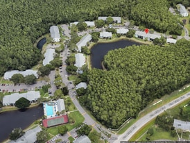 1353 Pine Ridge Cir E, Unit 128 E3 in Tarpon Springs, FL - Building Photo