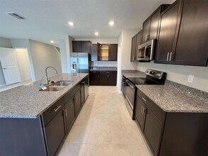 15621 Spice Key St in Sun City Center, FL - Foto de edificio - Building Photo