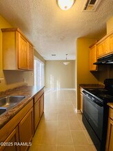 108 W Whispering Pines Cir in Lafayette, LA - Building Photo - Building Photo