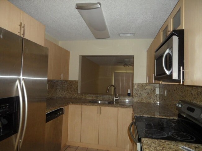 property at 221 Palm Cir E
