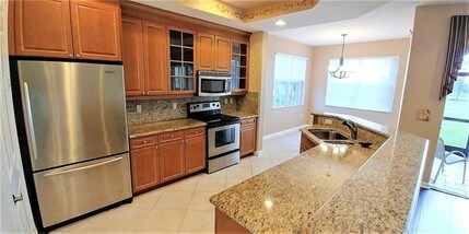 8001 NW 128th Ln-Unit -# 8001 in Parkland, FL - Foto de edificio - Building Photo