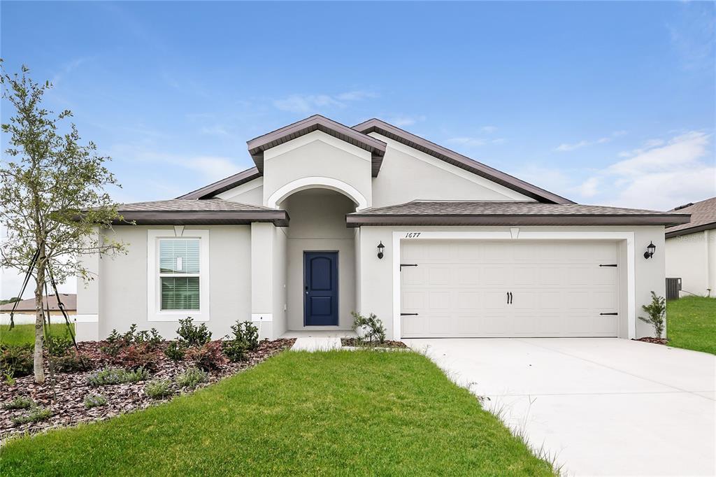 1677 Hideaway Flat St in Mascotte, FL - Building Photo