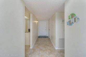 155 A1A Jimmy Buffett Mem Hwy-Unit -407 in Satellite Beach, FL - Building Photo - Building Photo